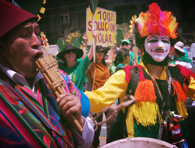 photo of demonstrators in colorful costumes